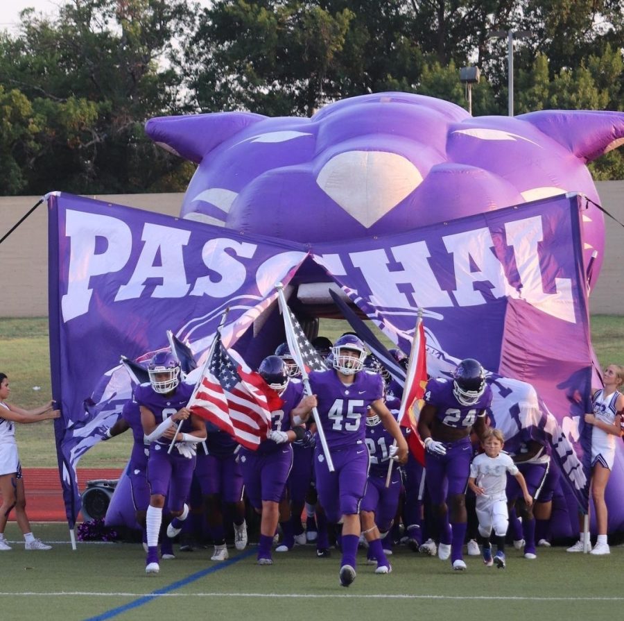Panther 2021-2022 football team rushing the field before their game against Irving last season.