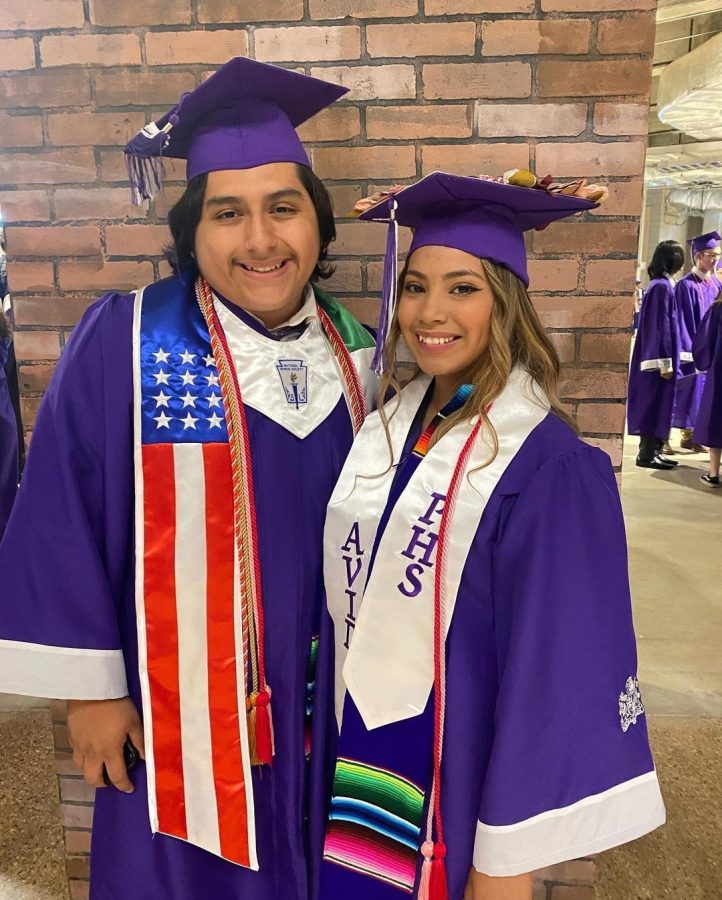 Former seniors Yovana Perez and Xavier Montemayor pose for a photo after the class of 22  graduation  