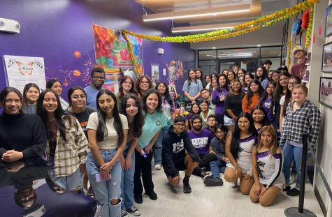 Paschal’s Hispanic Society gathers behind the foyer to take a group photo the day before their big Dia de los Muertos ceremony