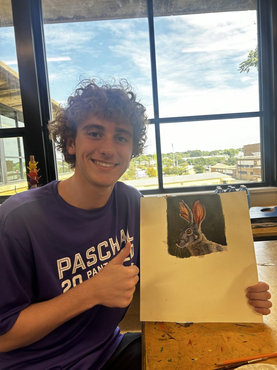 Stratton Whitworth, Paschal senior, smiles with his drawing. 