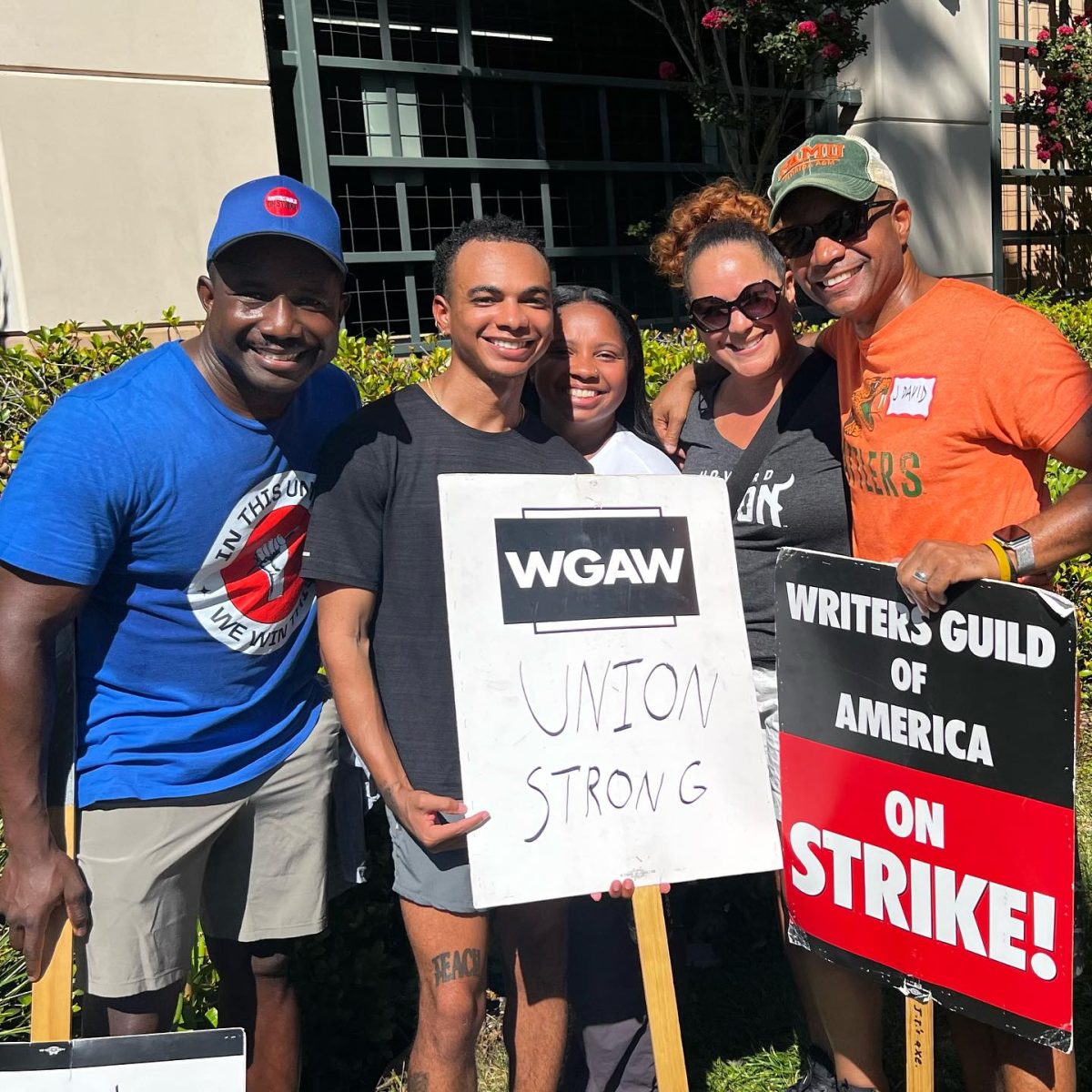 Marqui Jackson (left) pictured with WGA signs on August 31st (Marqui Jackson personal account on Facebook).
