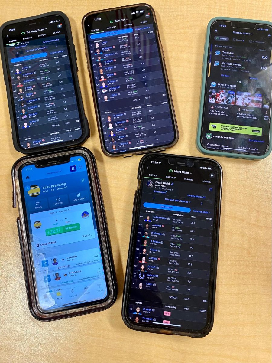 Student phones displaying fantasy standings. (Oct. 6th)