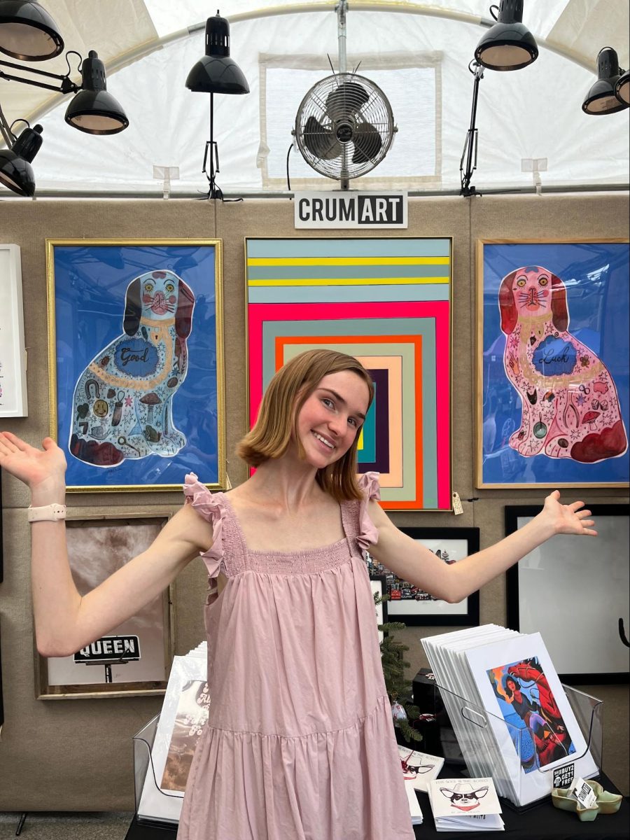 Caya Crum poses in front of her booth at ArtGoggle. (Taken Oct.21st)