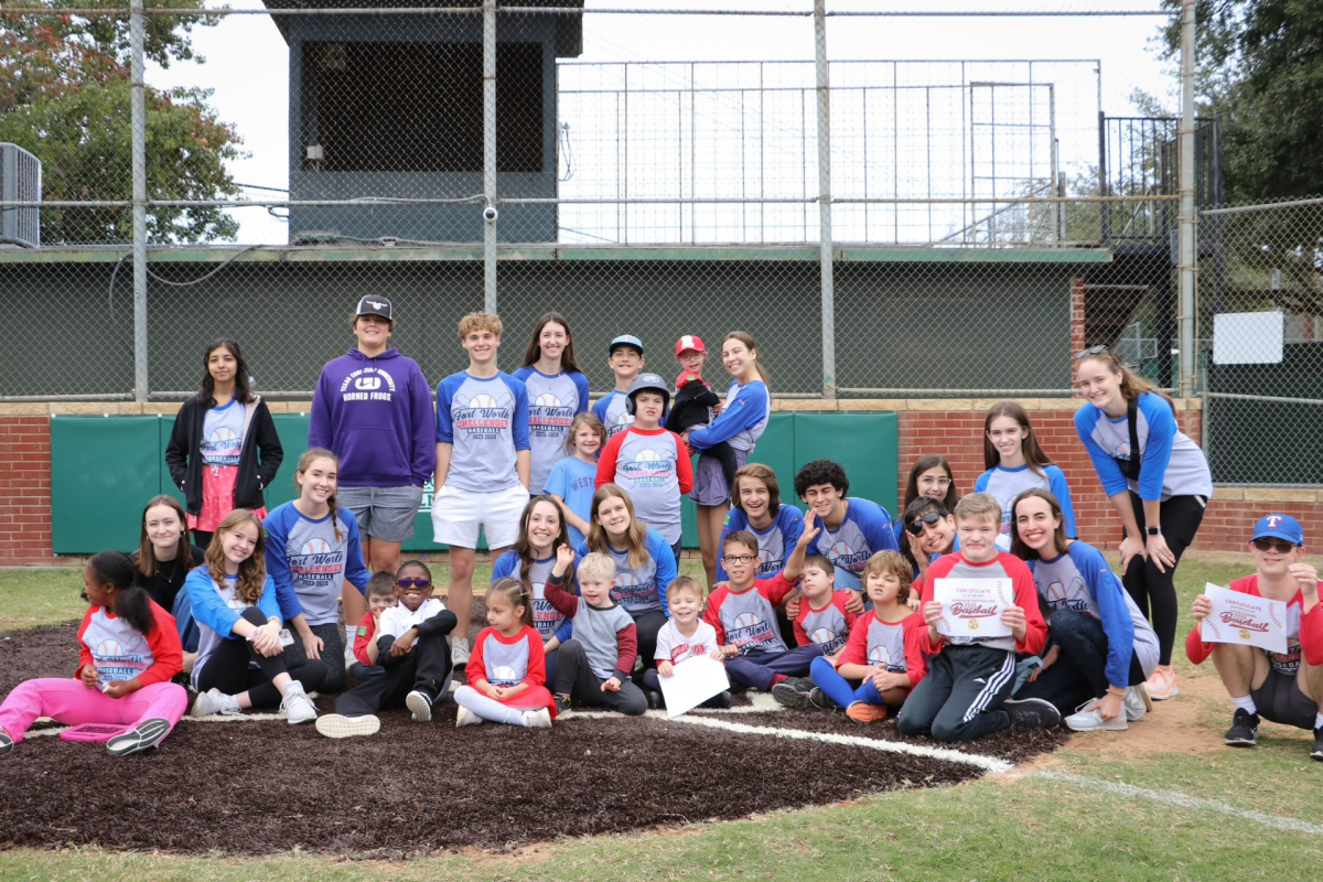 Paschal volunteers pose in a group photo with children in the Challengers program.