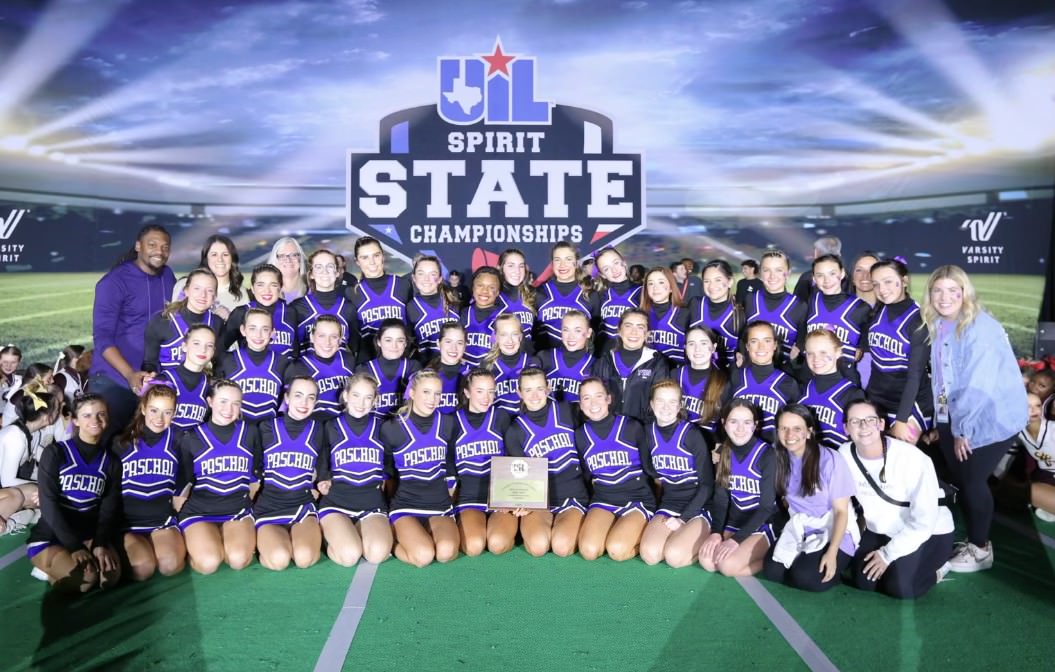 The Paschal Cheer team poses for a group photo at the UIL Spirit State Championship with their award for Best of Category for Band Chant in the 6A D2 Division.