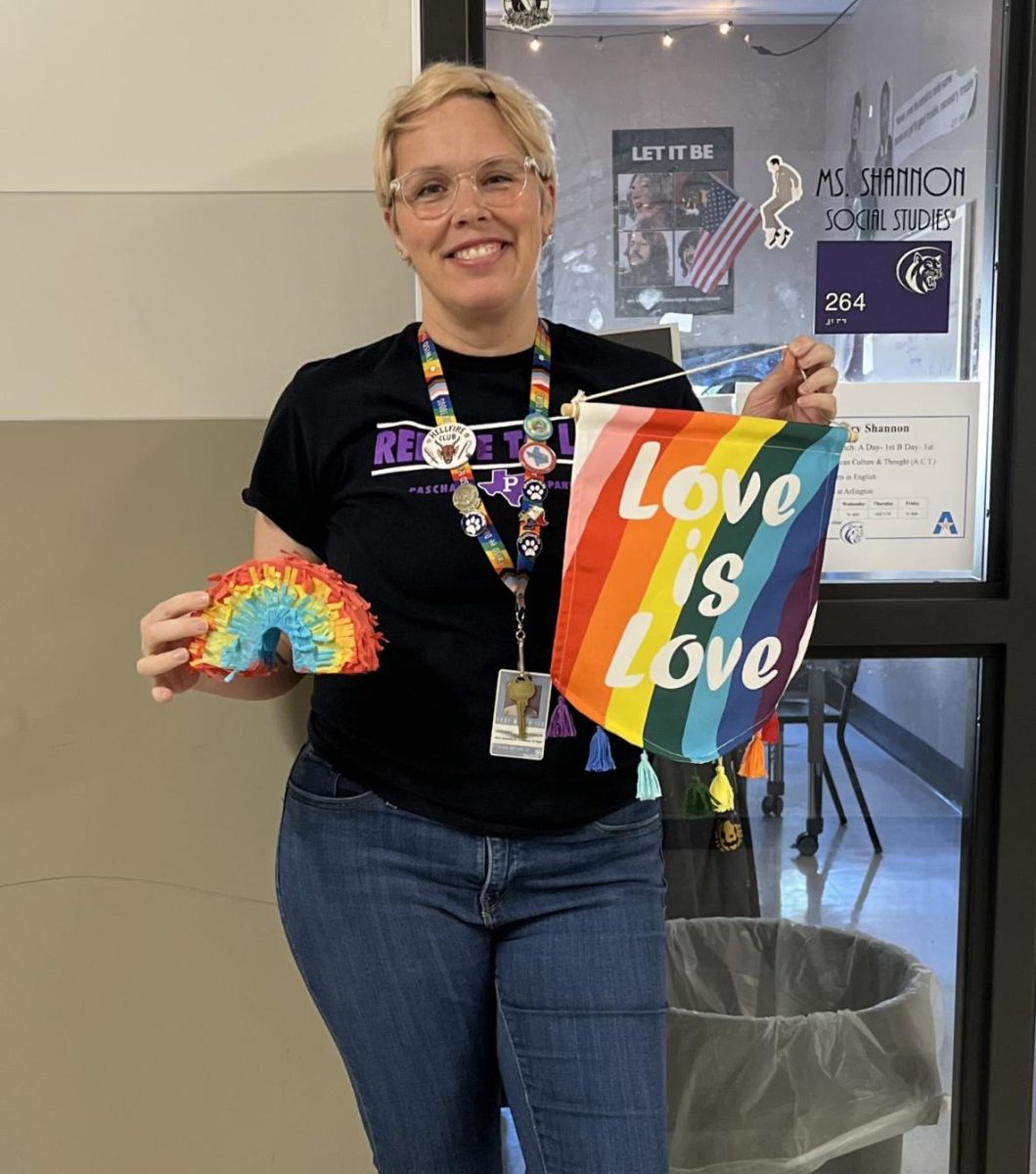 GSA sponsor Ms. Shannon poses in front of her room. 