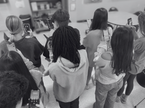 A group of Paschal students on their phones. 