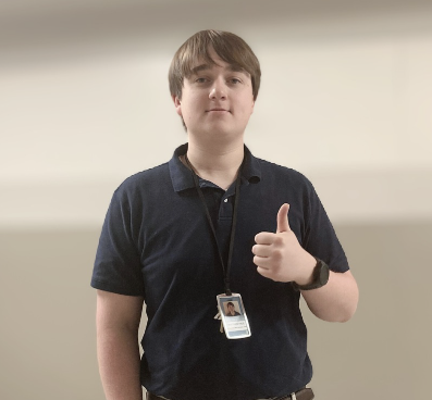 New math teacher Mr. Hale poses in the hallway. 