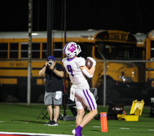 Luke Tevis (12) catches a touchdown in the Polytechnic game. 