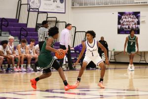 Nikolus Freeman (10) blocks an opponent during the game against Arlington. 