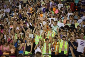 The PHS student section cheering on the football team at the Neon Homecoming game against Chisholm Trail.