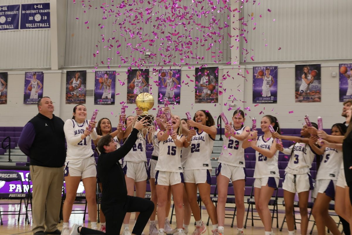 The Paschal girls basketball team celebrating their district win. 