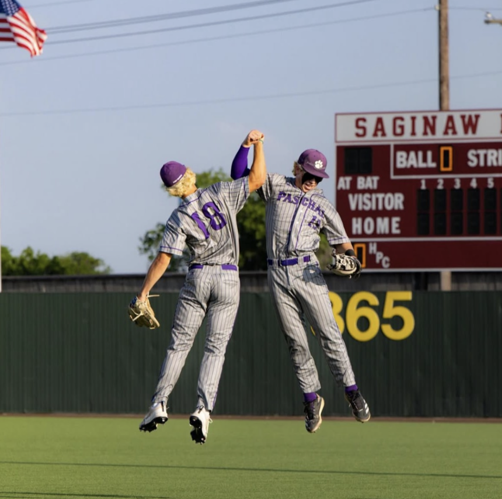 Luke Jowers (12) and Truman Shelton celebrate during bi-district championship.