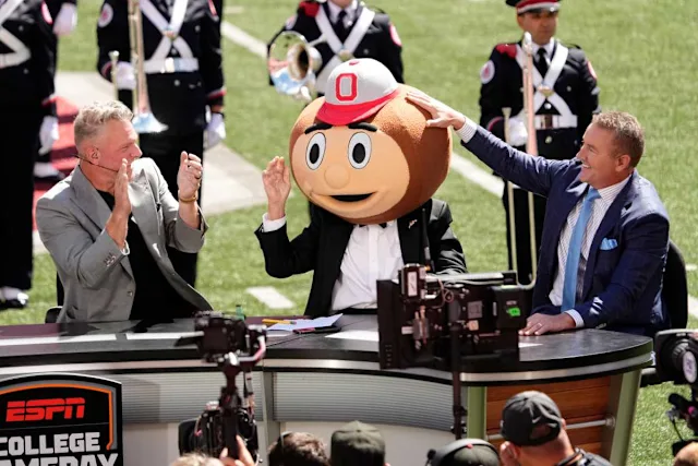 Lee Corso puts on the Brutus head for the last time before the Texas at Ohio State game.