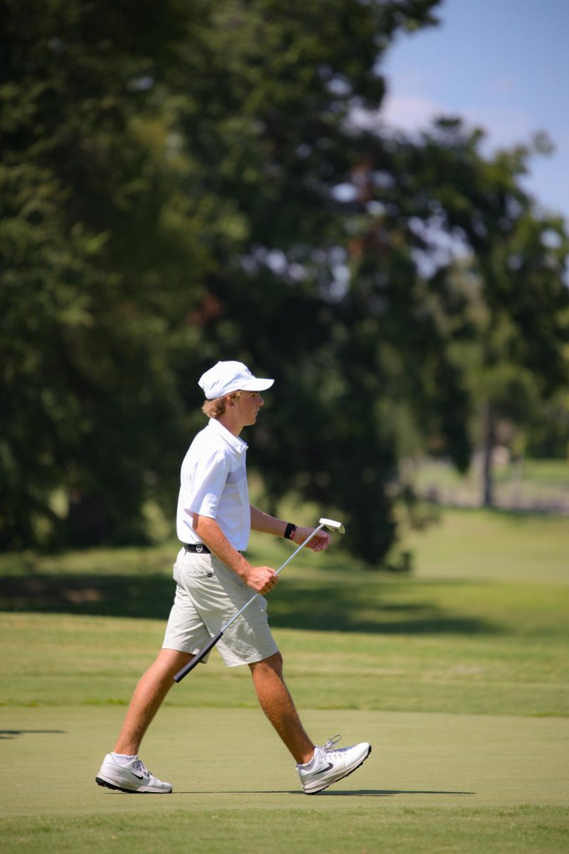 Parker Brown (10th) walking off the court after sinking a putt